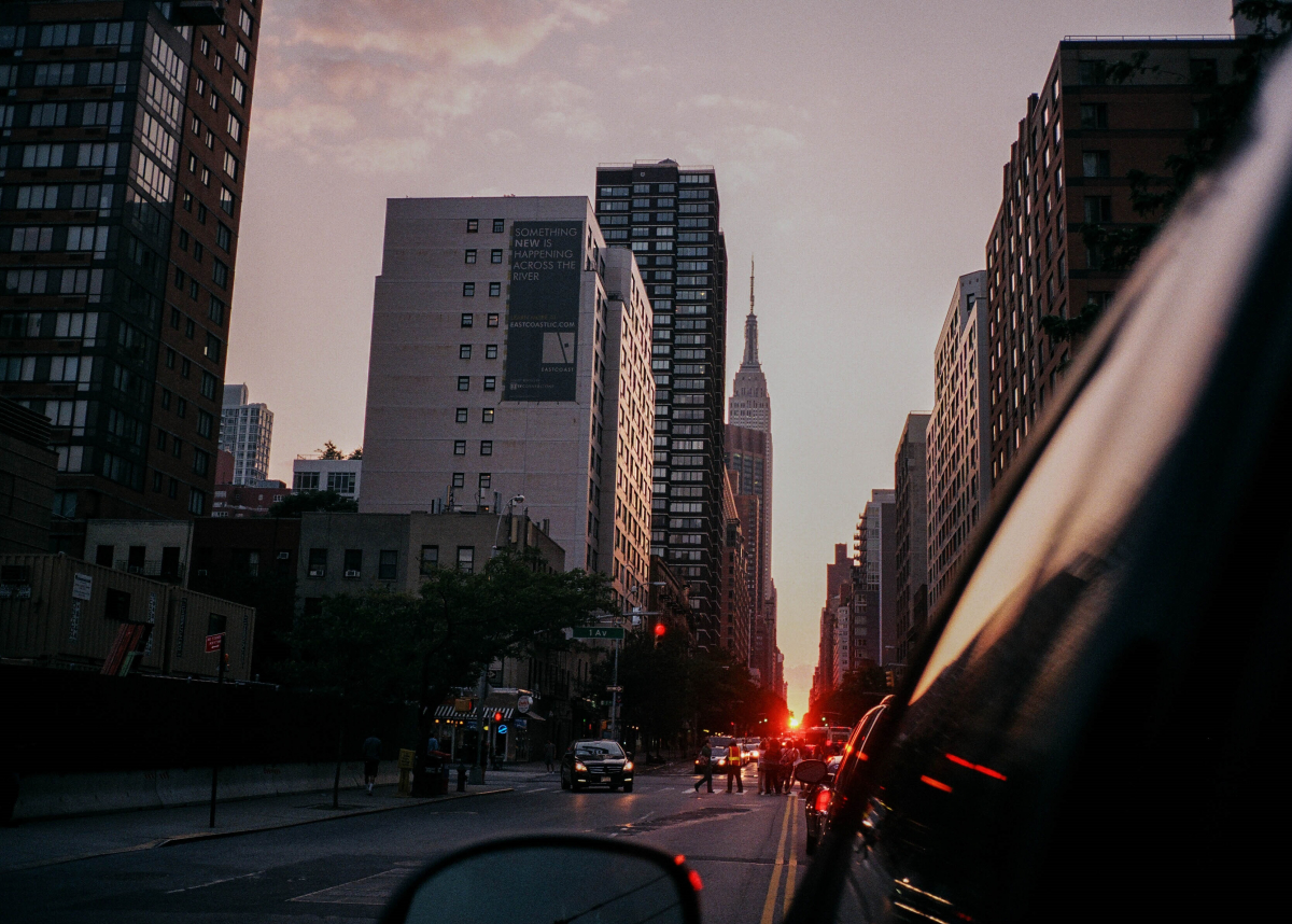 Riding in an rideshare app view of manhattan sunset